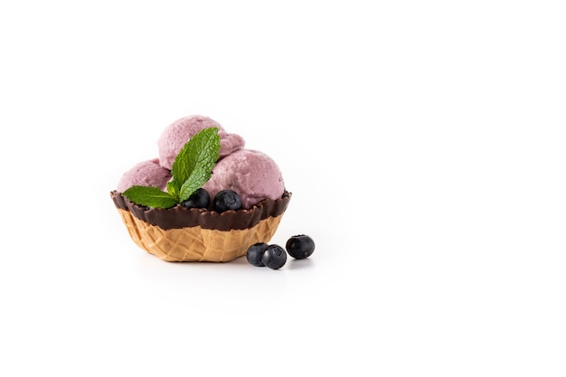 Blueberry ice cream scoop in paper cup