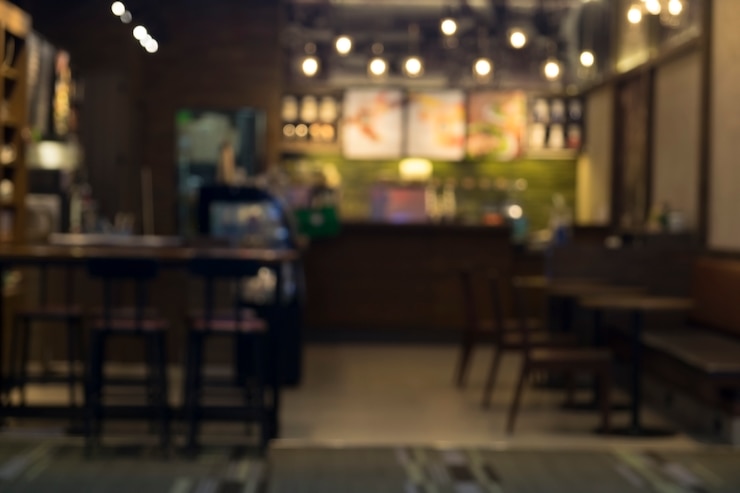 無料Photo ボケの背景を持つコーヒーショップカフェブラー。