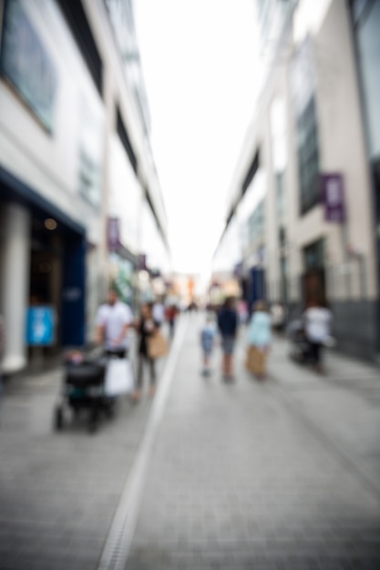 Free photo blur view of pedestrian walking on street