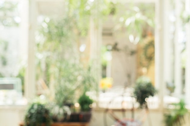 Blurred background - Coffee shop in garden blur background with bokeh. Vintage filtered image.