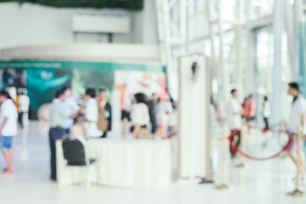 Blurred background : people shopping at market fair in sunny day, blur background with bokeh.