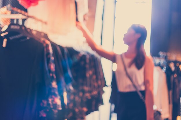 Blurred background of woman looking for clothes