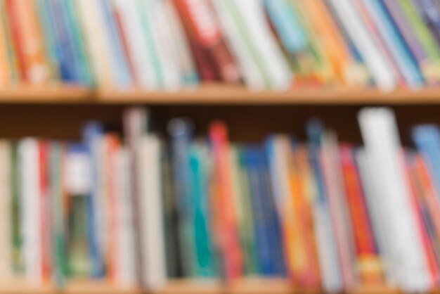 Blurred books on library bookcase