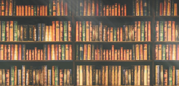 Premium Photo | Blurred bookshelf many old books in a book shop or library.