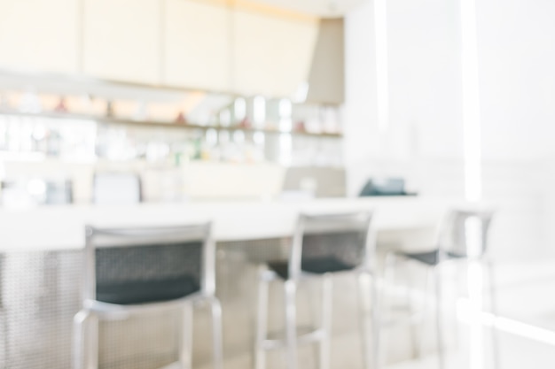 Blurred coffee shop with three chairs