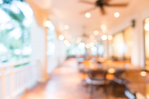 Blurred corridor with chairs and tables