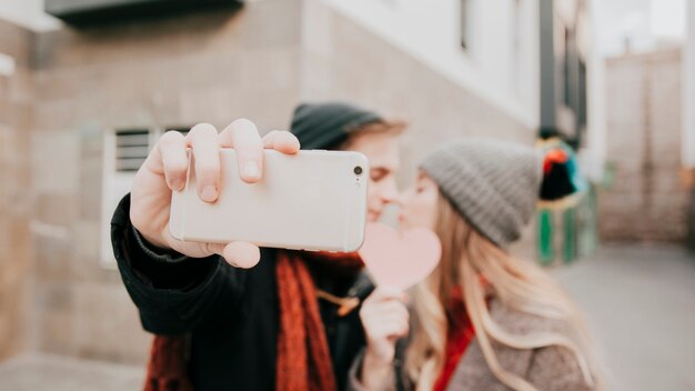 Blurred couple taking selfie