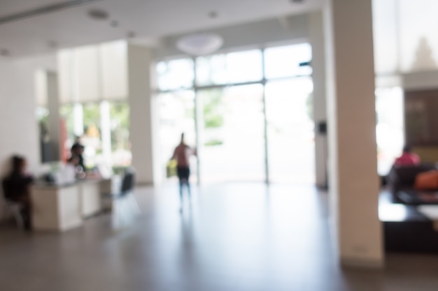 Blurred hotel reception with people sitting