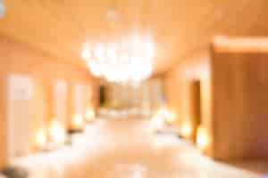 Free photo blurred illuminated wooden hall