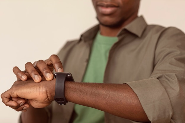 Blurred man checking his smart watch