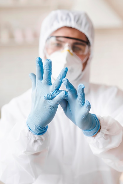 Free photo blurred man wearing protective gloves