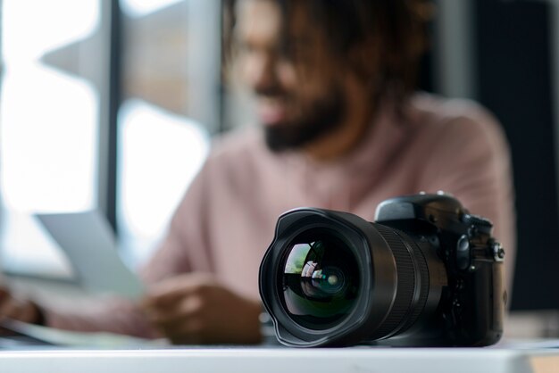 Blurred man with photo camera