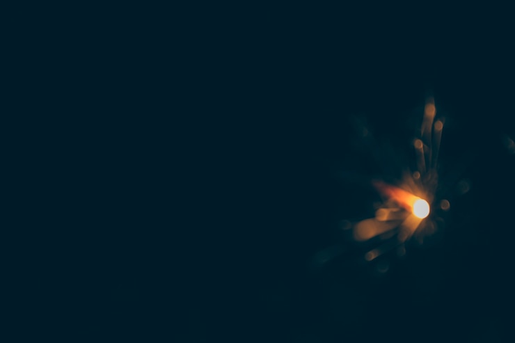Free Photo blurred new year eve sparkler at night