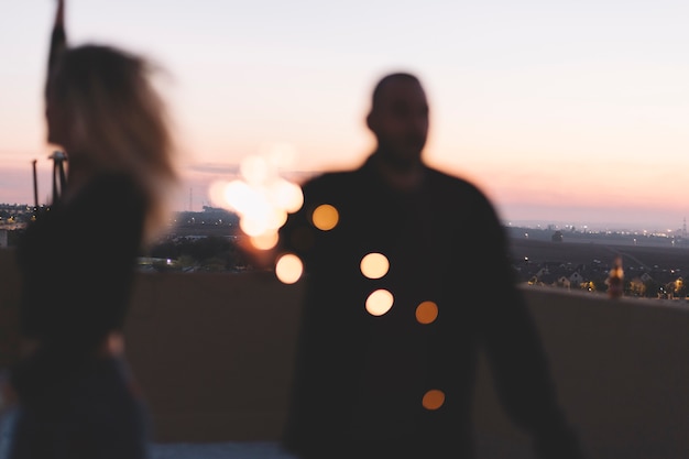 Free photo blurred people with sparklers