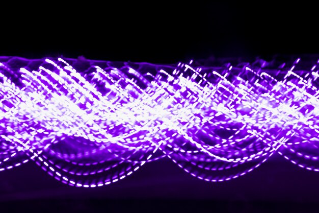 Blurred purple decorative light on black backdrop