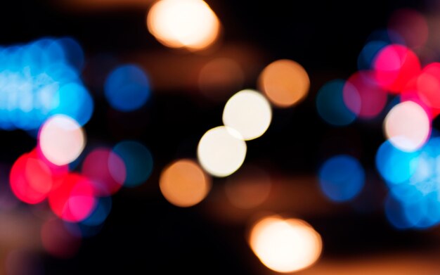 Blurred street bokeh lights at night time