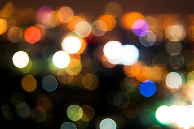 Blurred street bokeh lights at night time