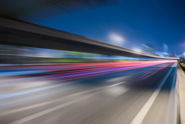 blurred traffic light trails on road