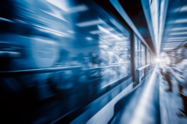 Blurred train at night leaving station