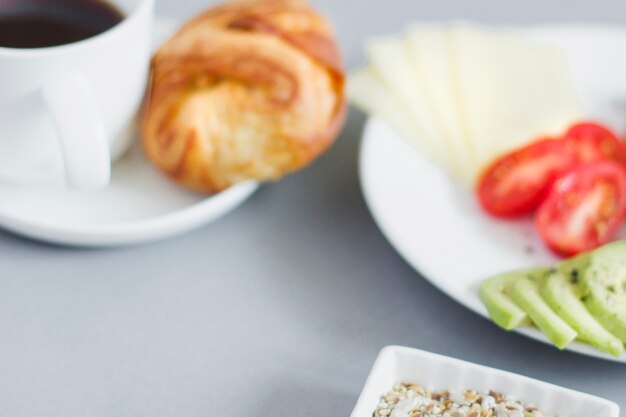 Blurred view of breakfast plates and coffee