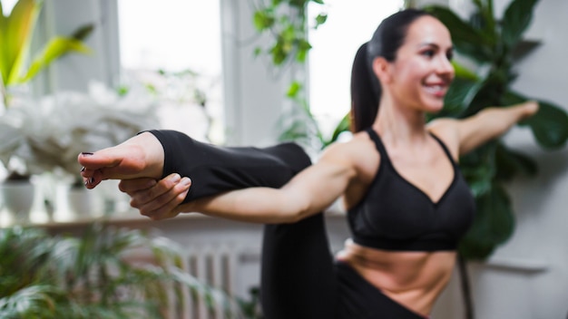 Free photo blurred woman in balancing pose