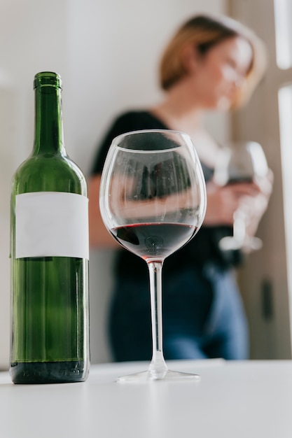 Blurred woman drinking wine