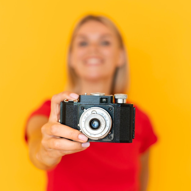 Blurred woman holding camera