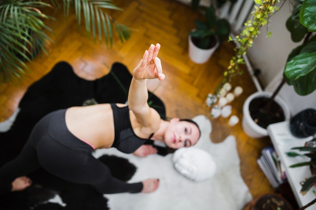 Blurred woman in warrior pose bending forward