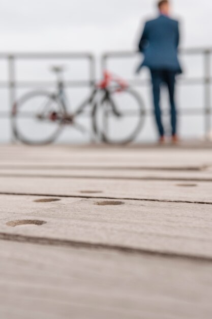 blurry man in costume standing next to a bike