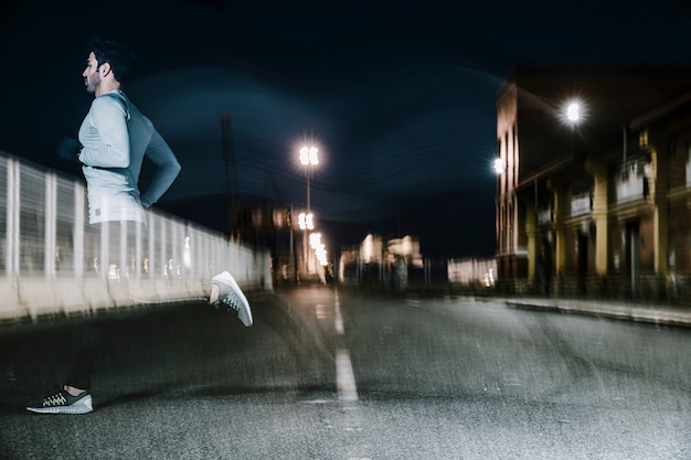 Blurry man in twilight running on road