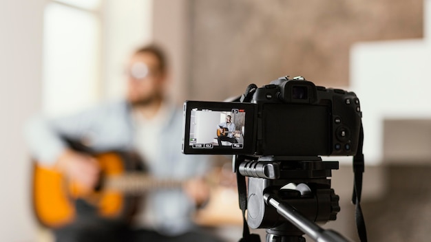 Blurry musician recording himself