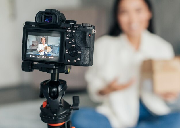 Blurry woman live streaming at home