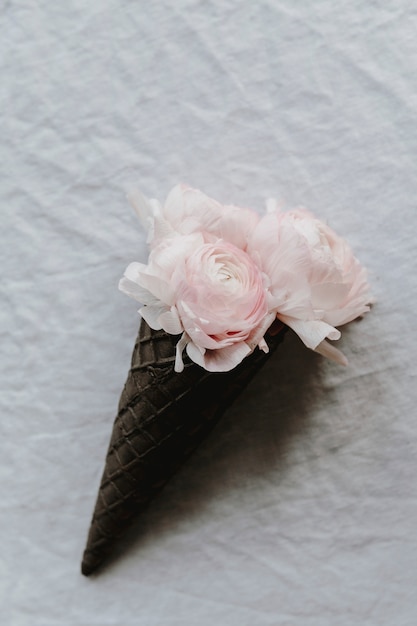 Blush ranunculus in a waffle cone