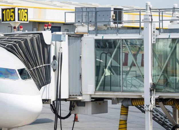 Boarding bridge connected to airplane 