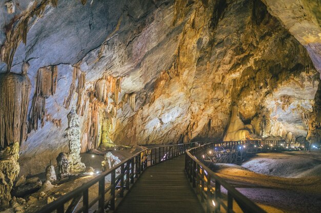 Boardwalk through the lit Paradise Cave in Vietnam