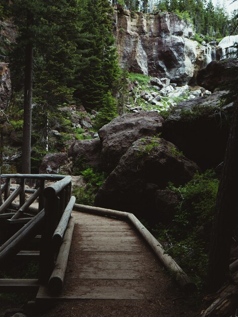 Boardwalk through a park with rocks and boulders