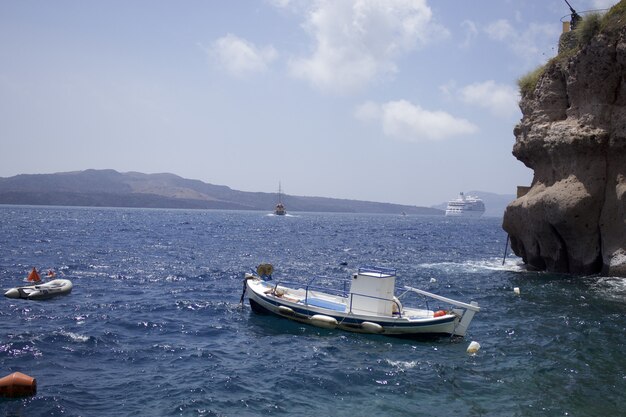 Boat on body of water near island