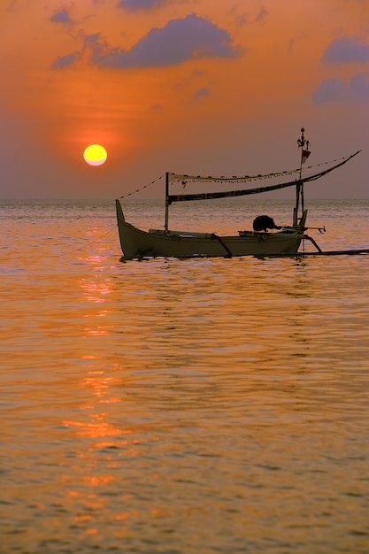 Boat fishing at the sunset