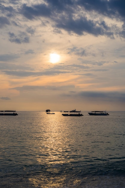 Boat in the water at sunset, ocean, background.