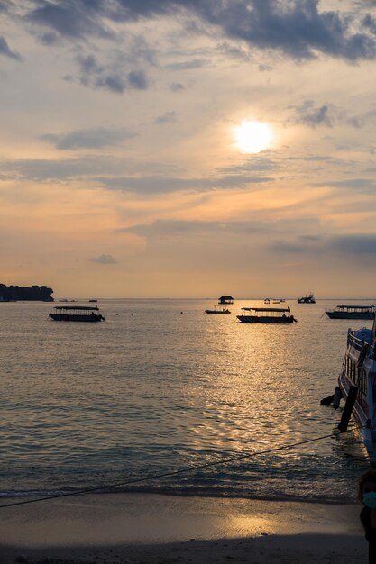 Boat in the water at sunset, ocean, background.