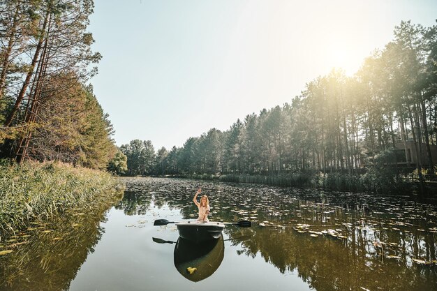 Boating. A woman sitting in a boat and oaring