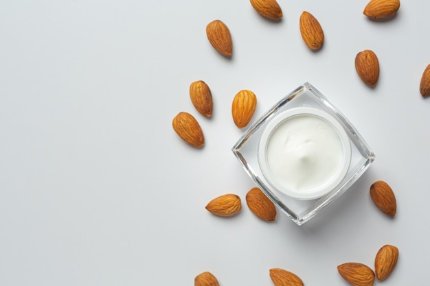 Free photo body almond moisturizer on white background