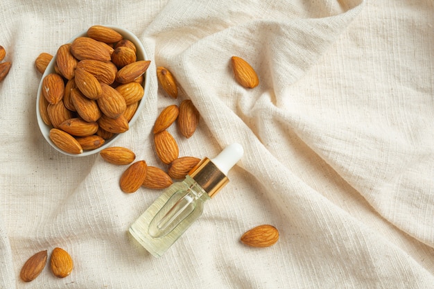 Body almond moisturizer on white background