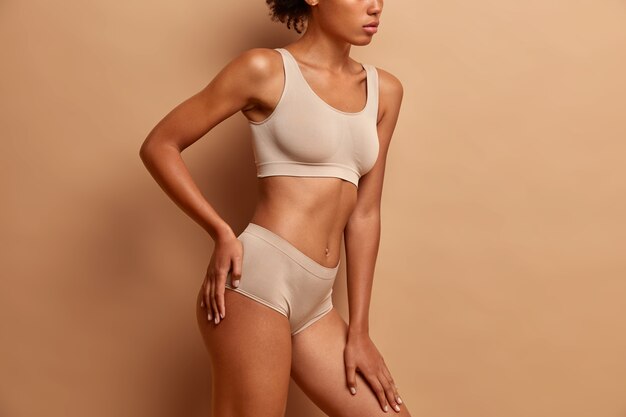 body care and beauty concept with young woman in underwear