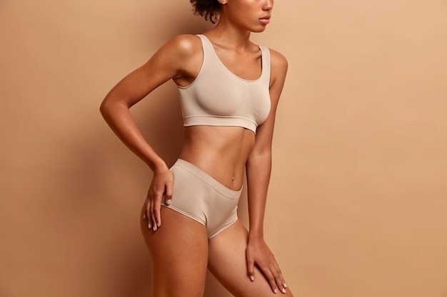 body care and beauty concept with young woman in underwear