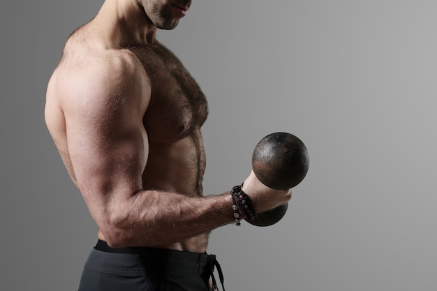 Bodybuilder posing and showing muscles