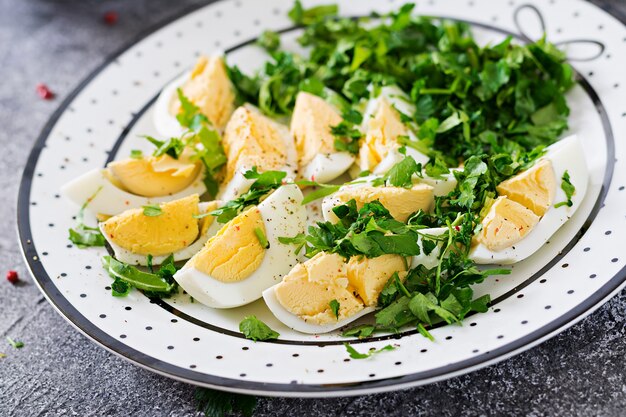 Boiled eggs with greens. Healthy food. Summer salad