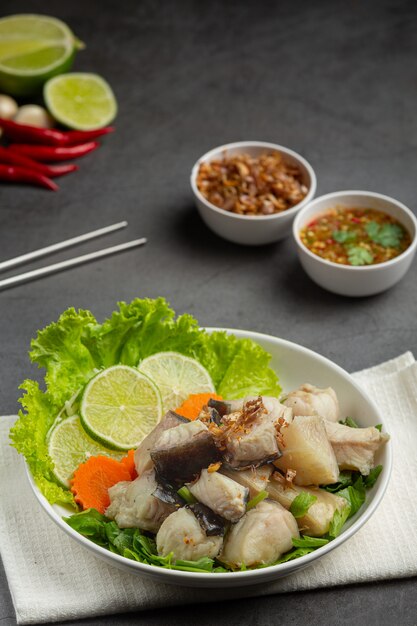 Boiled fish with spicy dipping sauce and vegetable