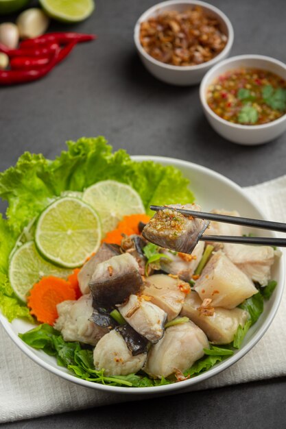 Boiled fish with spicy dipping sauce and vegetable