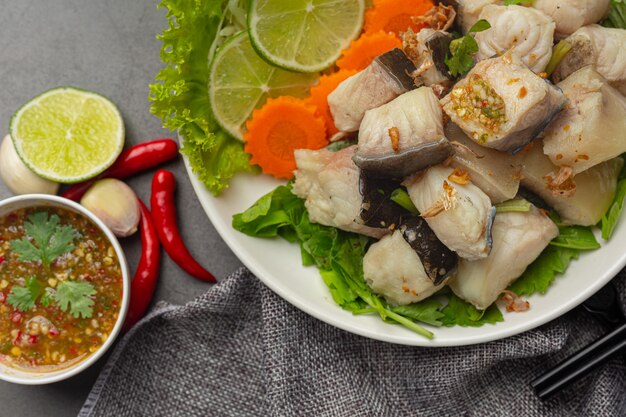 Boiled fish with spicy dipping sauce and vegetable